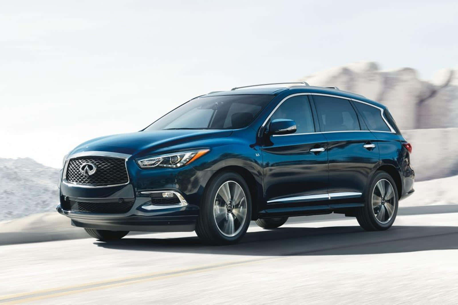 Sleek And Stylish Infiniti Qx60 On The Open Road Wallpaper