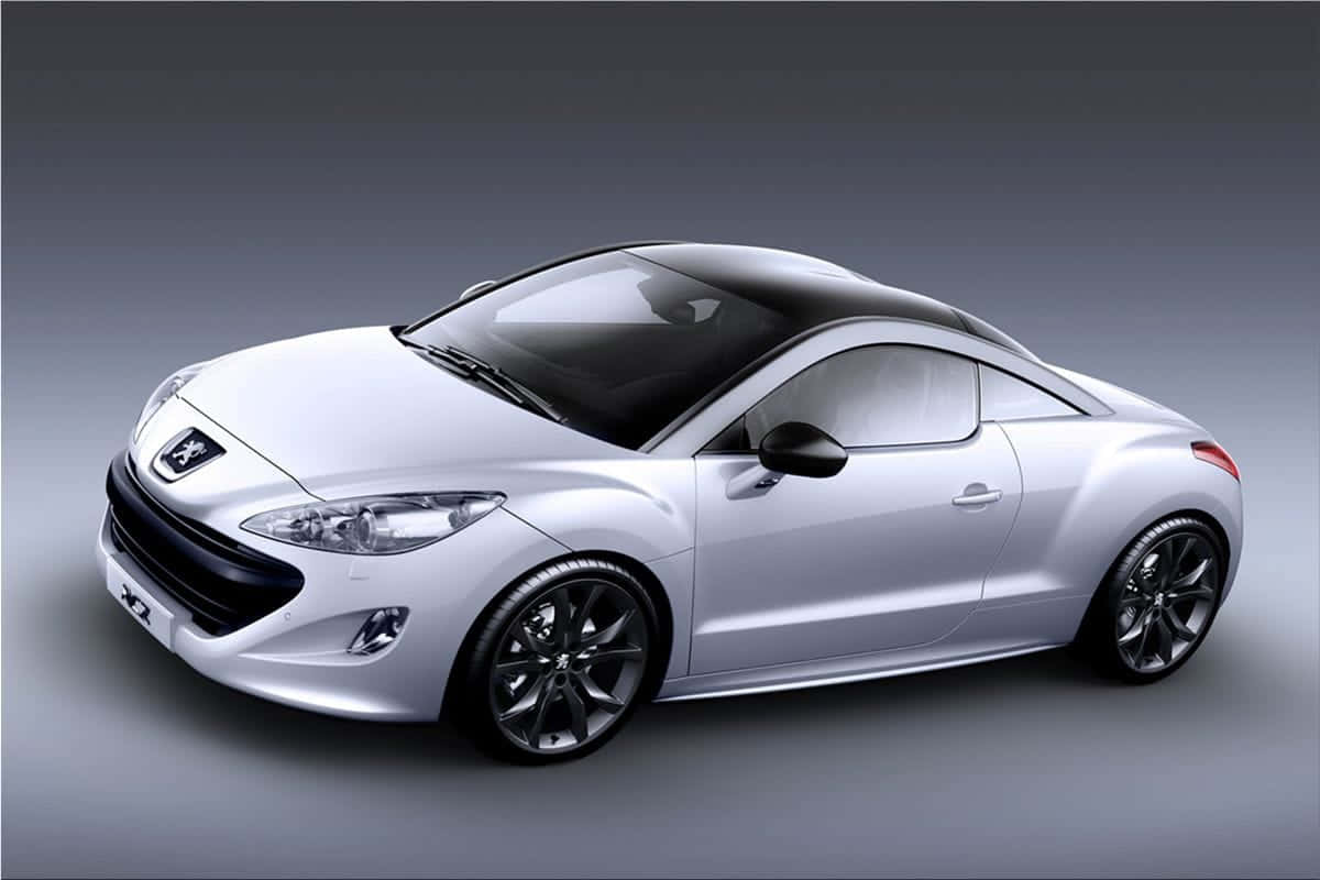 Sleek And Stylish Peugeot Rcz On The Road Wallpaper