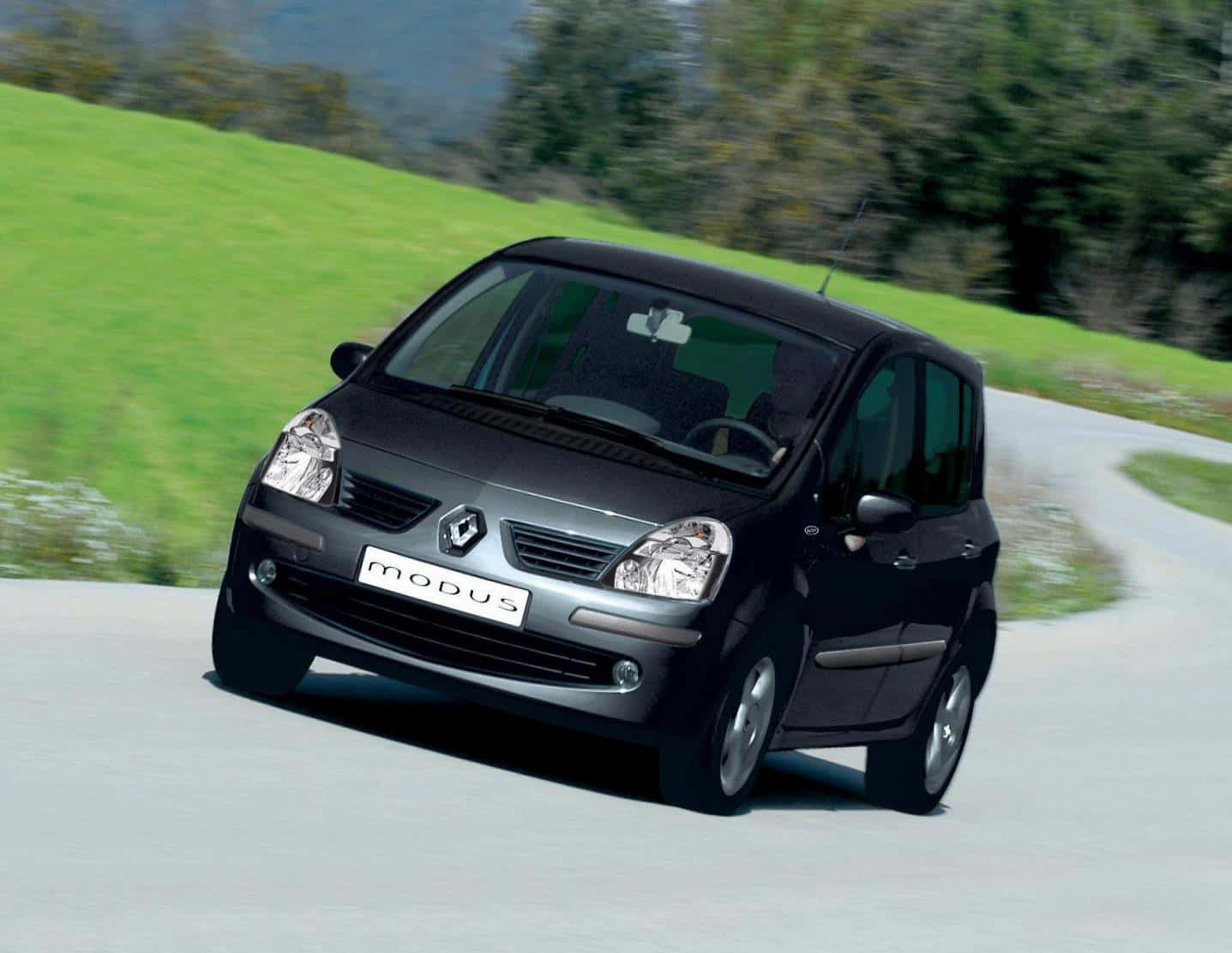 Sleek And Stylish Renault Modus On The Road Wallpaper