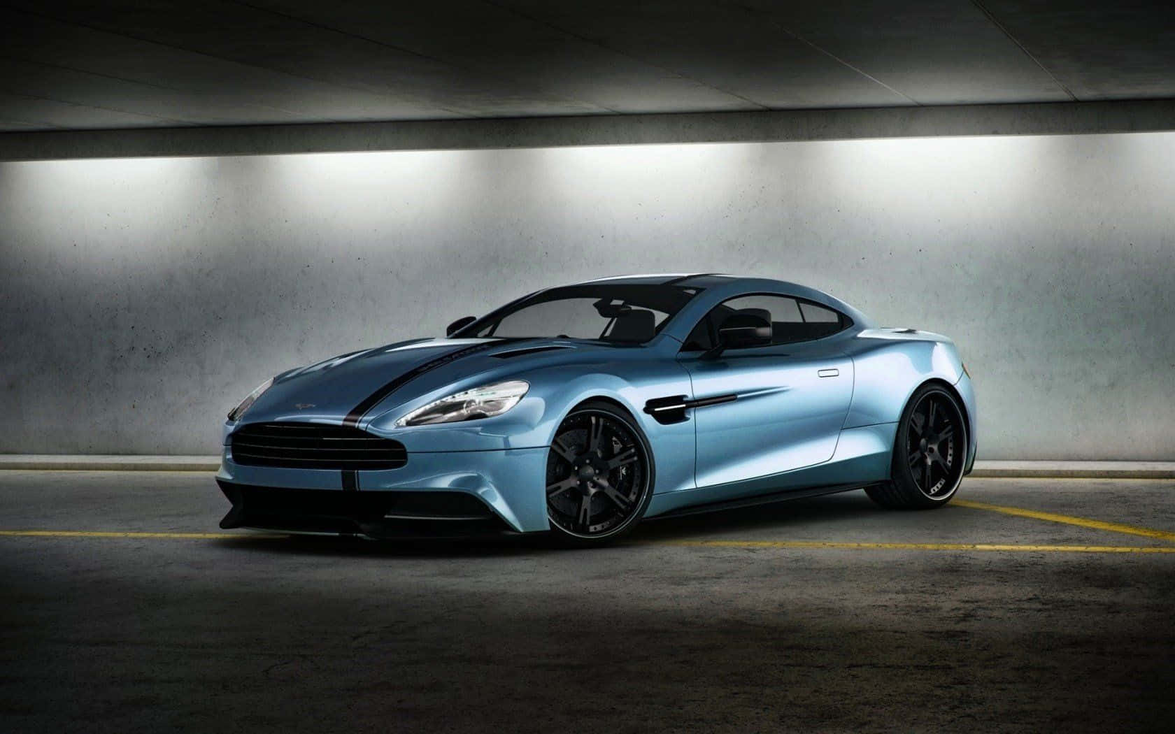 Sleek Aston Martin Vanquish In Motion Wallpaper