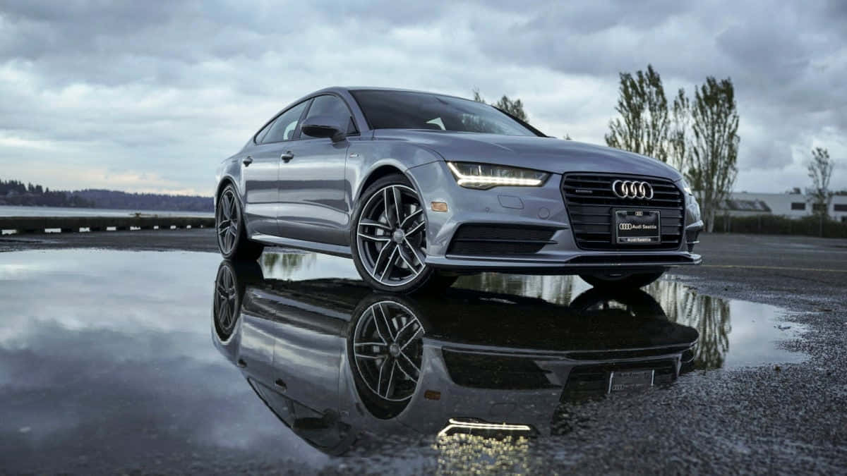 Sleek Audi S7 In Motion On The Open Road Wallpaper