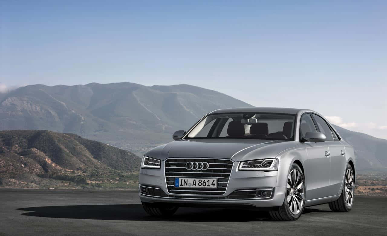 Sleek Audi S8 Sport Sedan On The Road Wallpaper