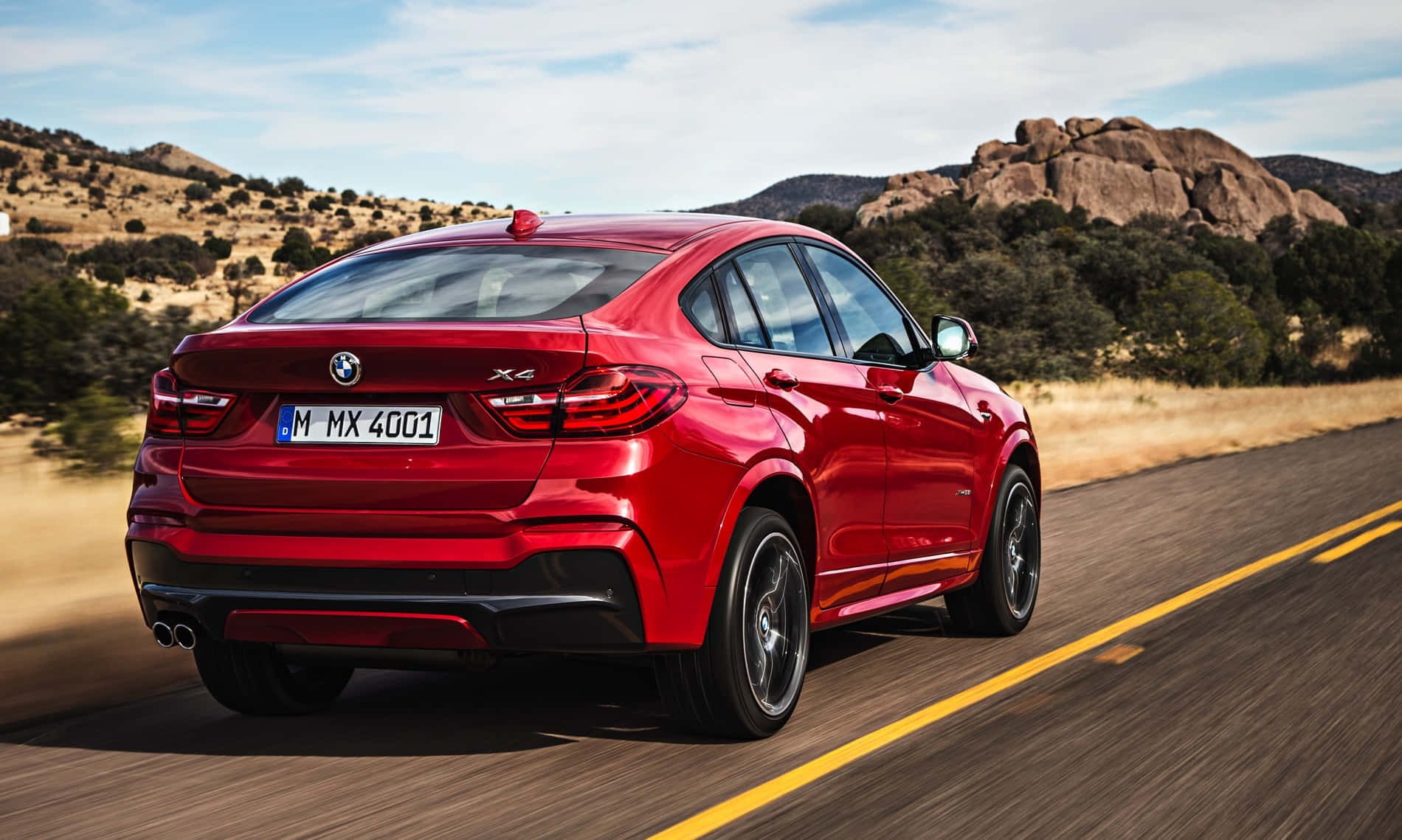 Sleek Bmw X4 On The Open Road Wallpaper