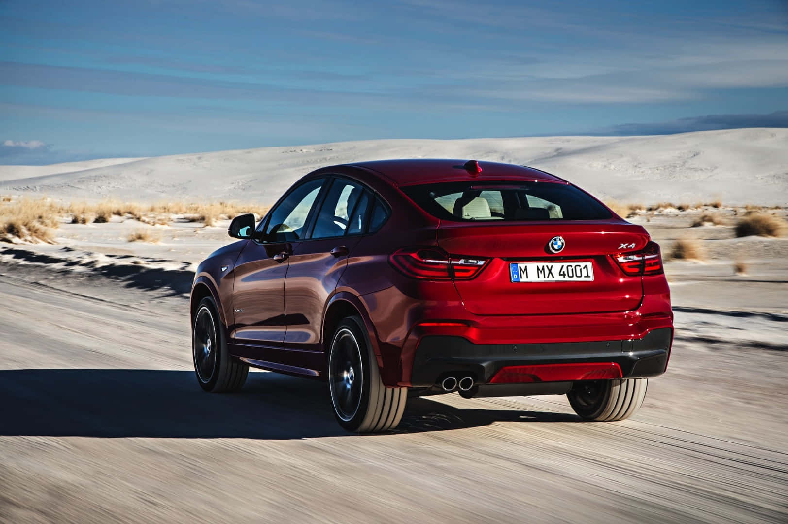 Sleek Bmw X4 On The Road Wallpaper