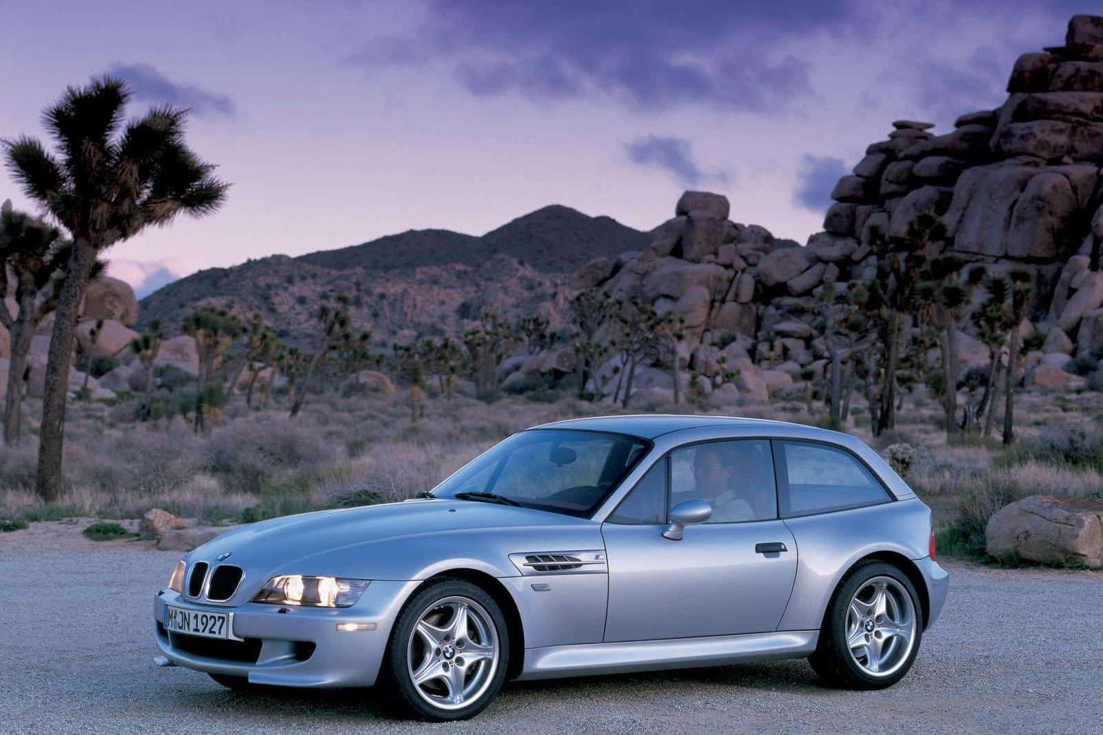 Sleek Bmw Z3 Cruising On An Open Road Wallpaper