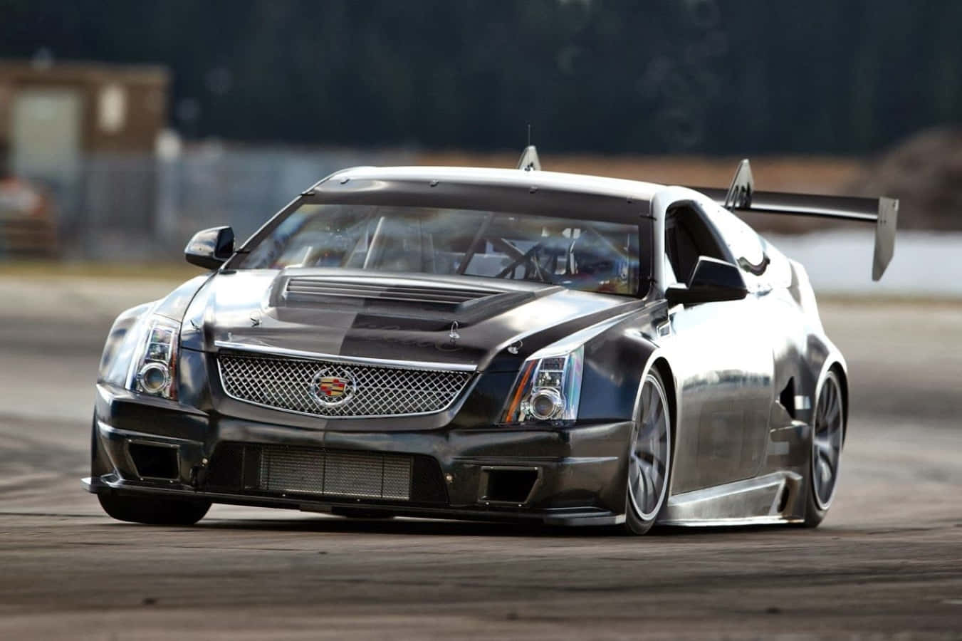 Sleek Cadillac Ats Cruising The Open Road Wallpaper