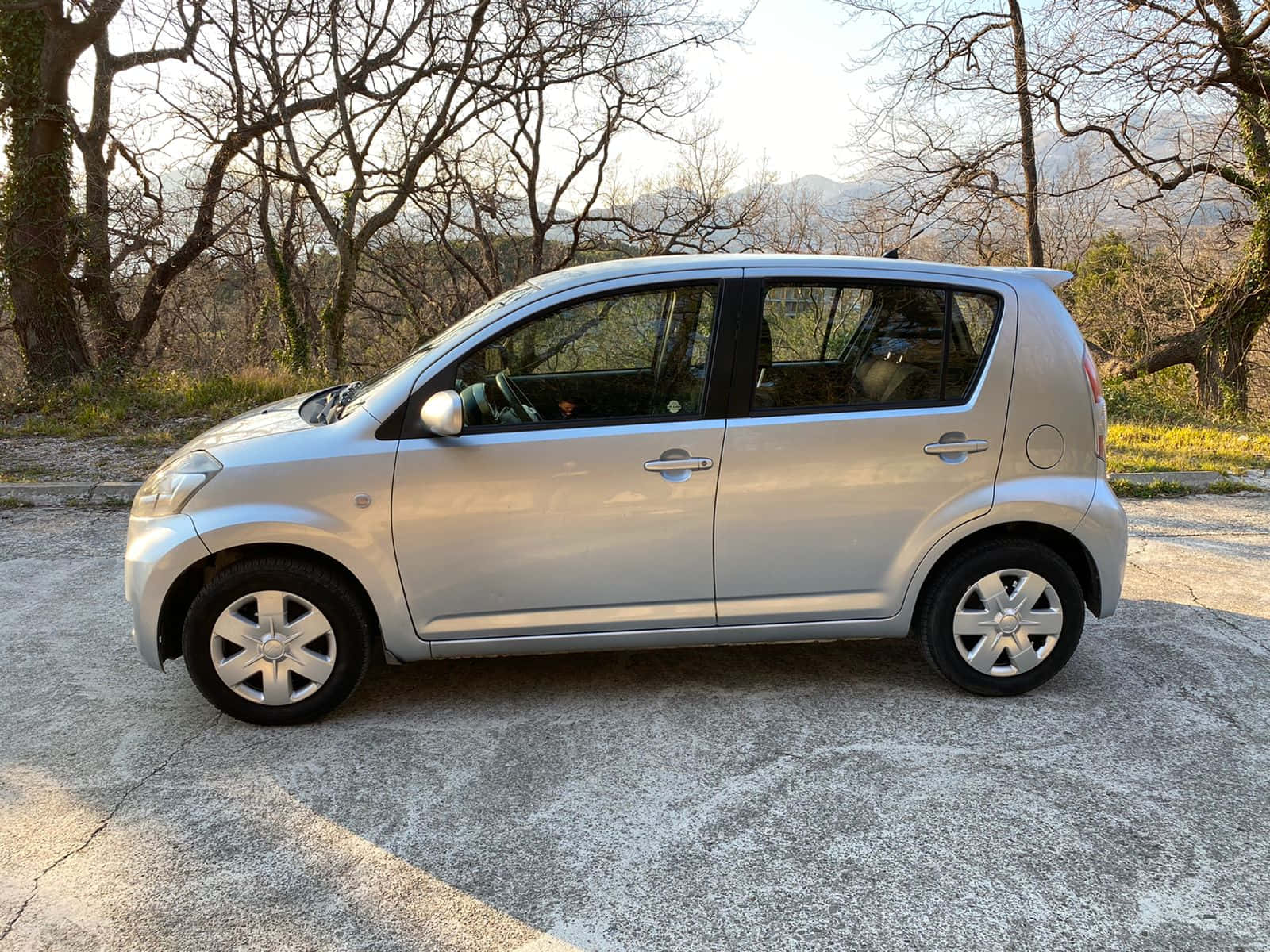 Sleek Design Of The Silver Daihatsu Sirion Wallpaper