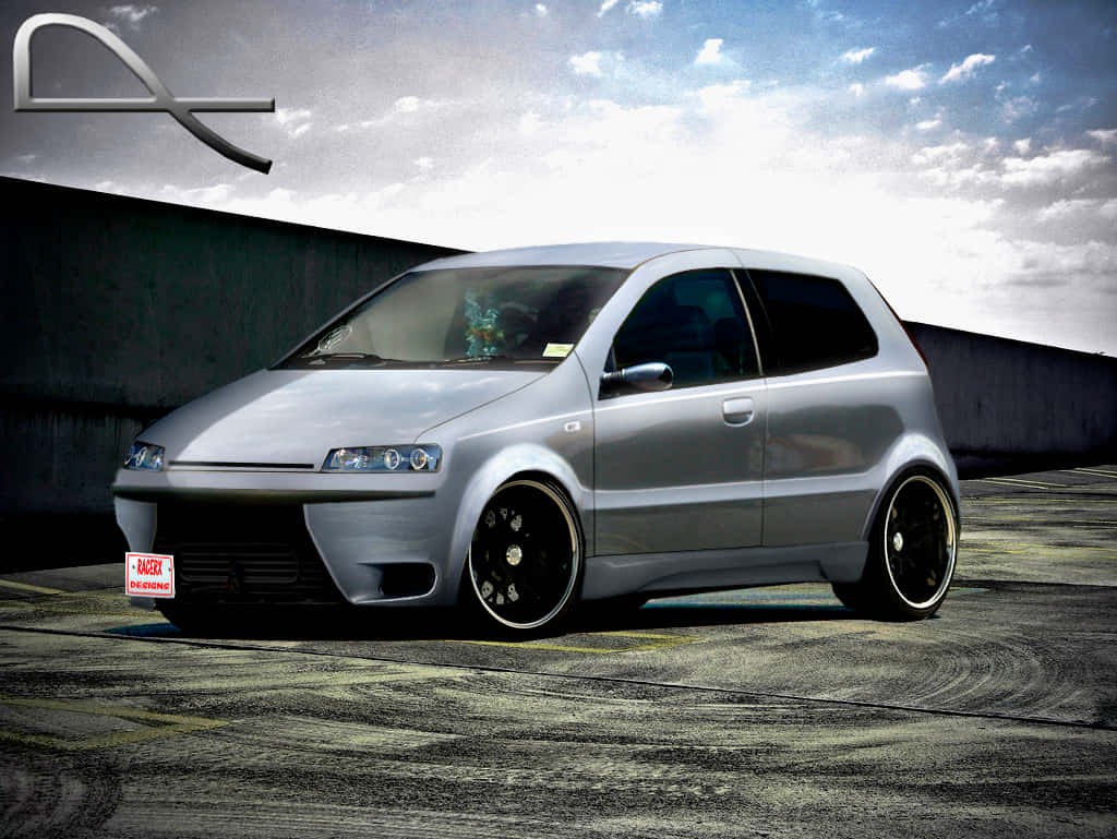 Sleek Fiat Grande Punto In Motion Wallpaper