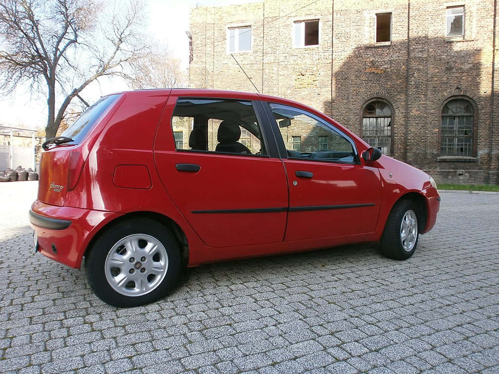 Sleek Fiat Punto Parked In Style Wallpaper