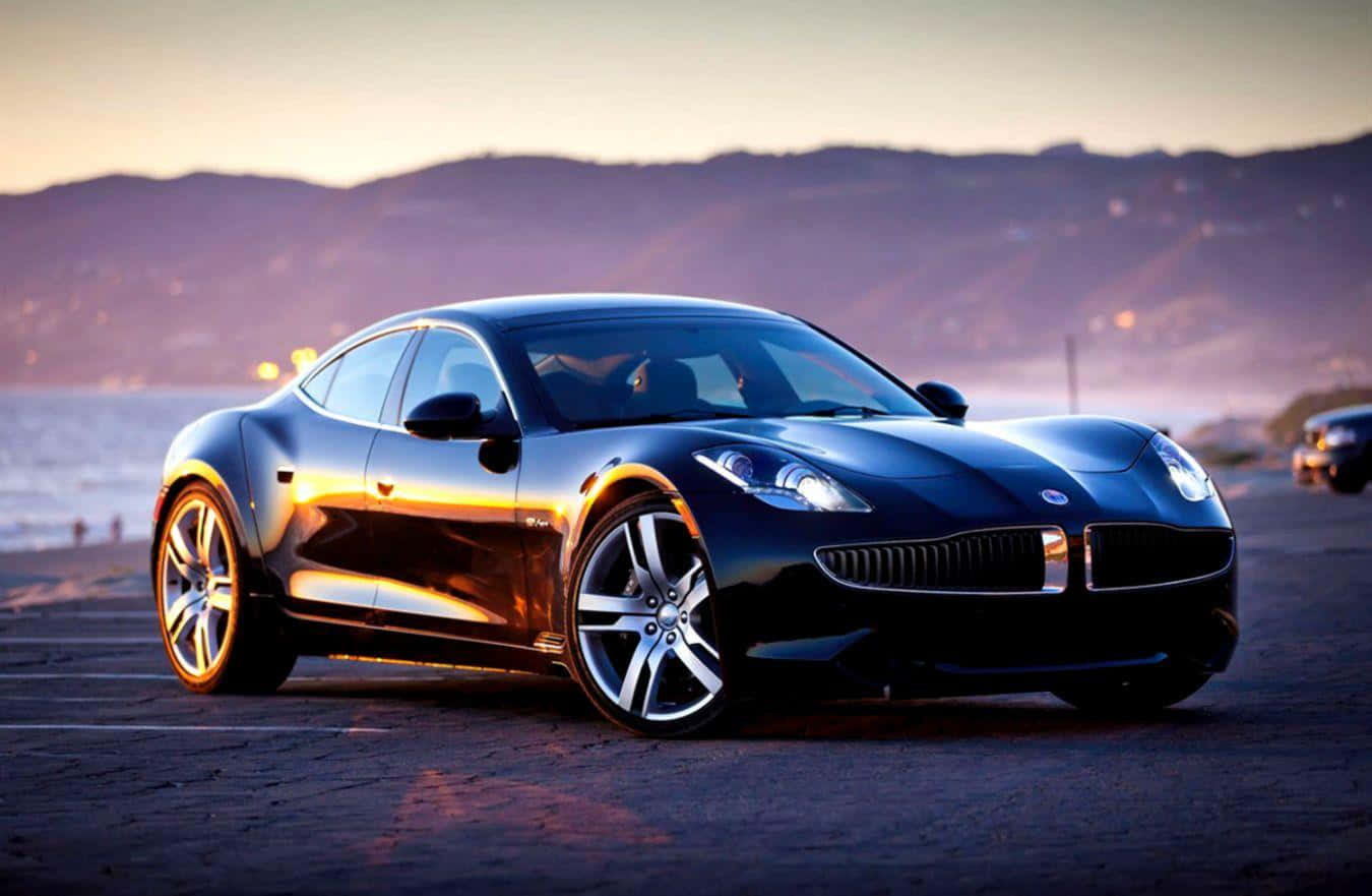 Sleek Fisker Electric Vehicle Parked At Sunset Wallpaper