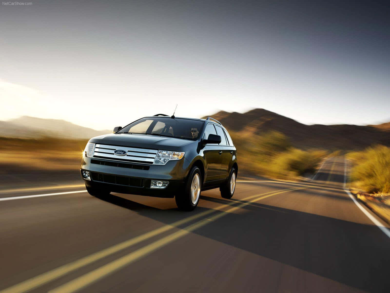 Sleek Ford Edge Cruising Through The City Streets Wallpaper