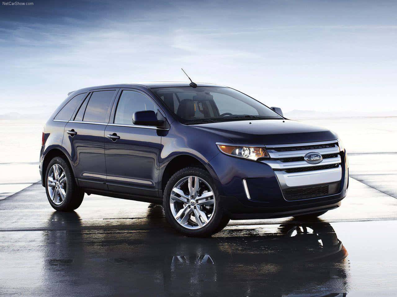 Sleek Ford Edge Suv Cruising Down The Open Road Wallpaper