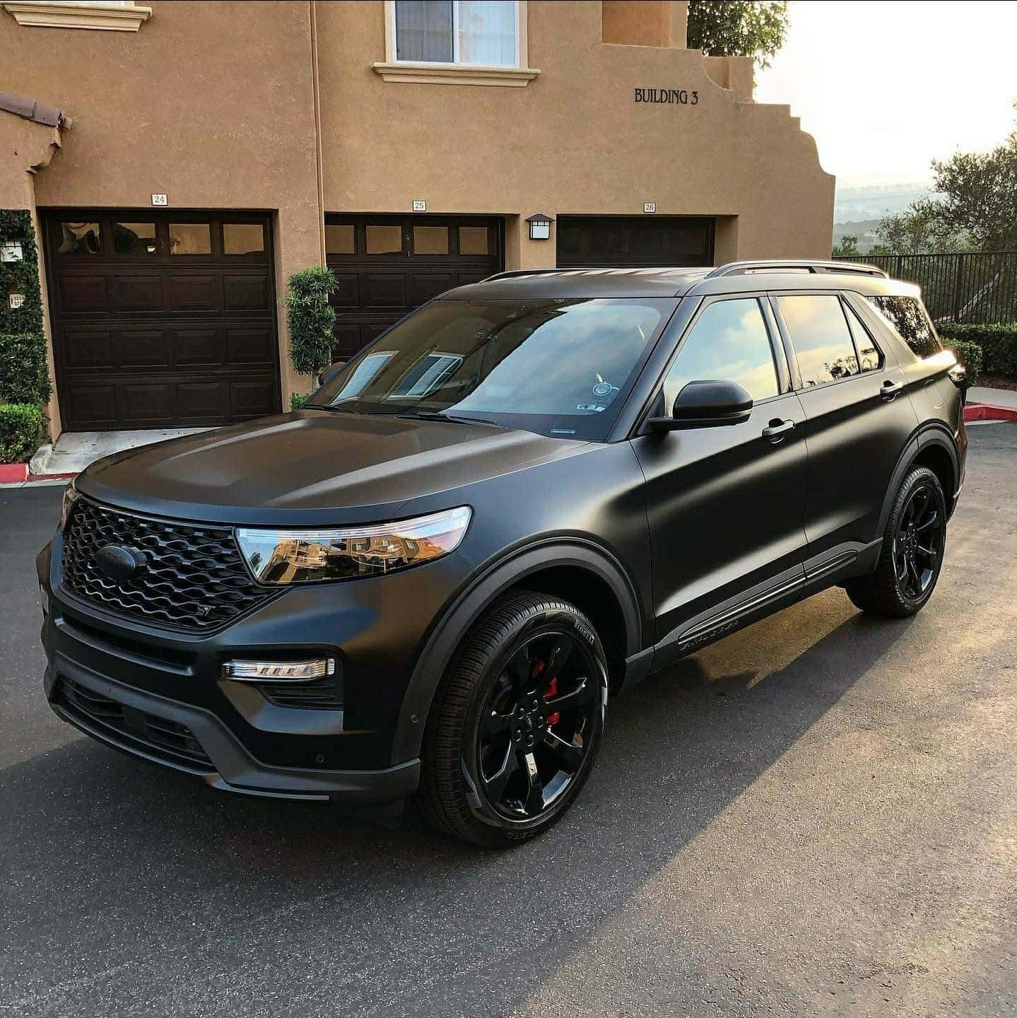 Sleek Ford Explorer On Scenic Road Wallpaper