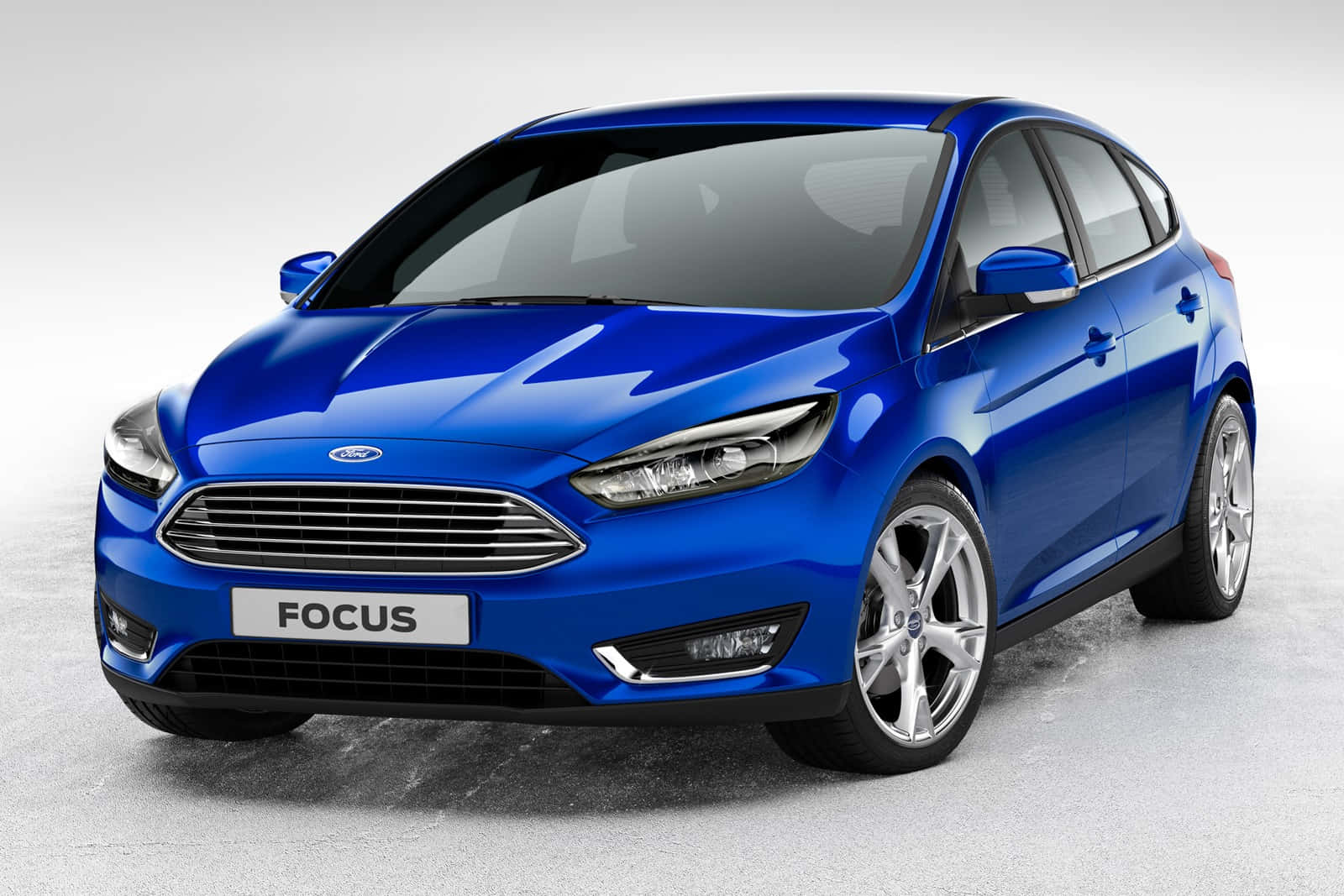 Sleek Ford Focus Cruising On An Open Road Wallpaper