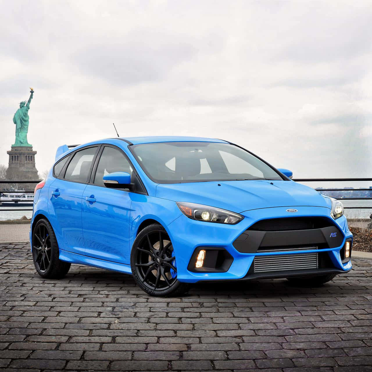 Sleek Ford Focus Cruising On Open Road Wallpaper