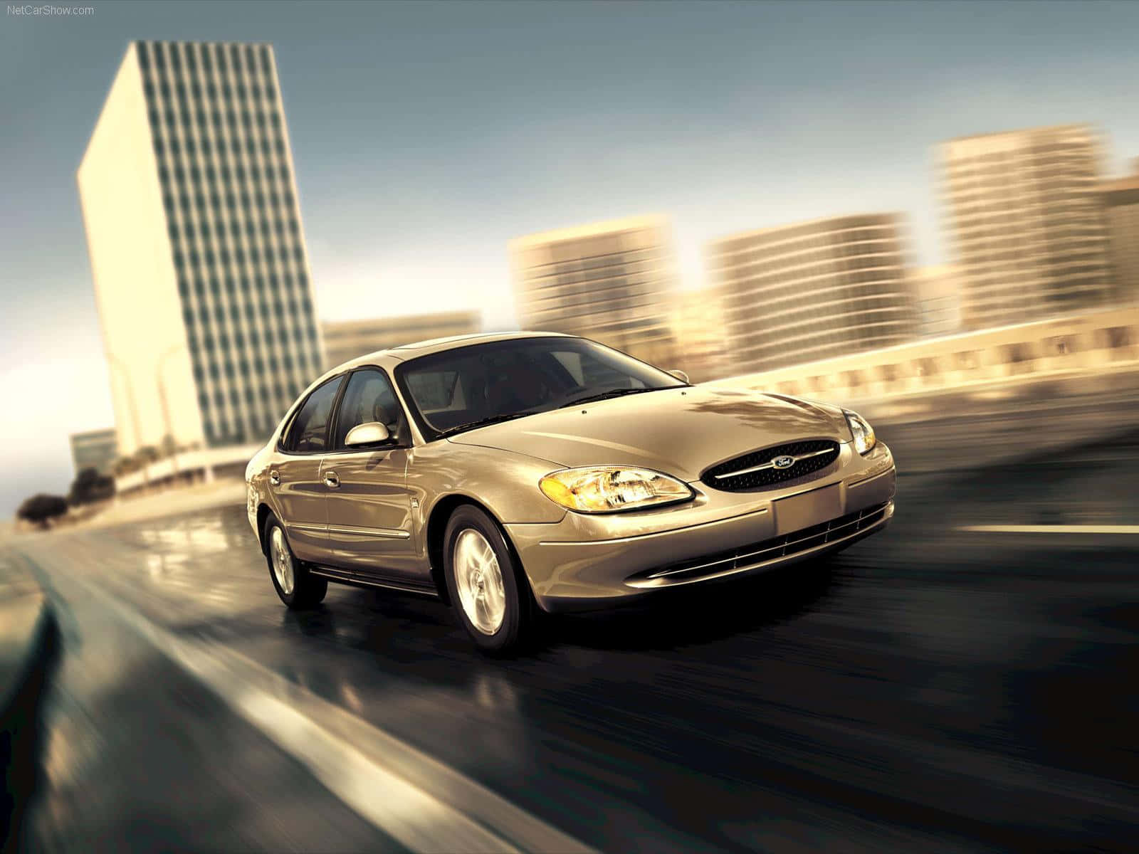 Sleek Ford Taurus On The Road Wallpaper