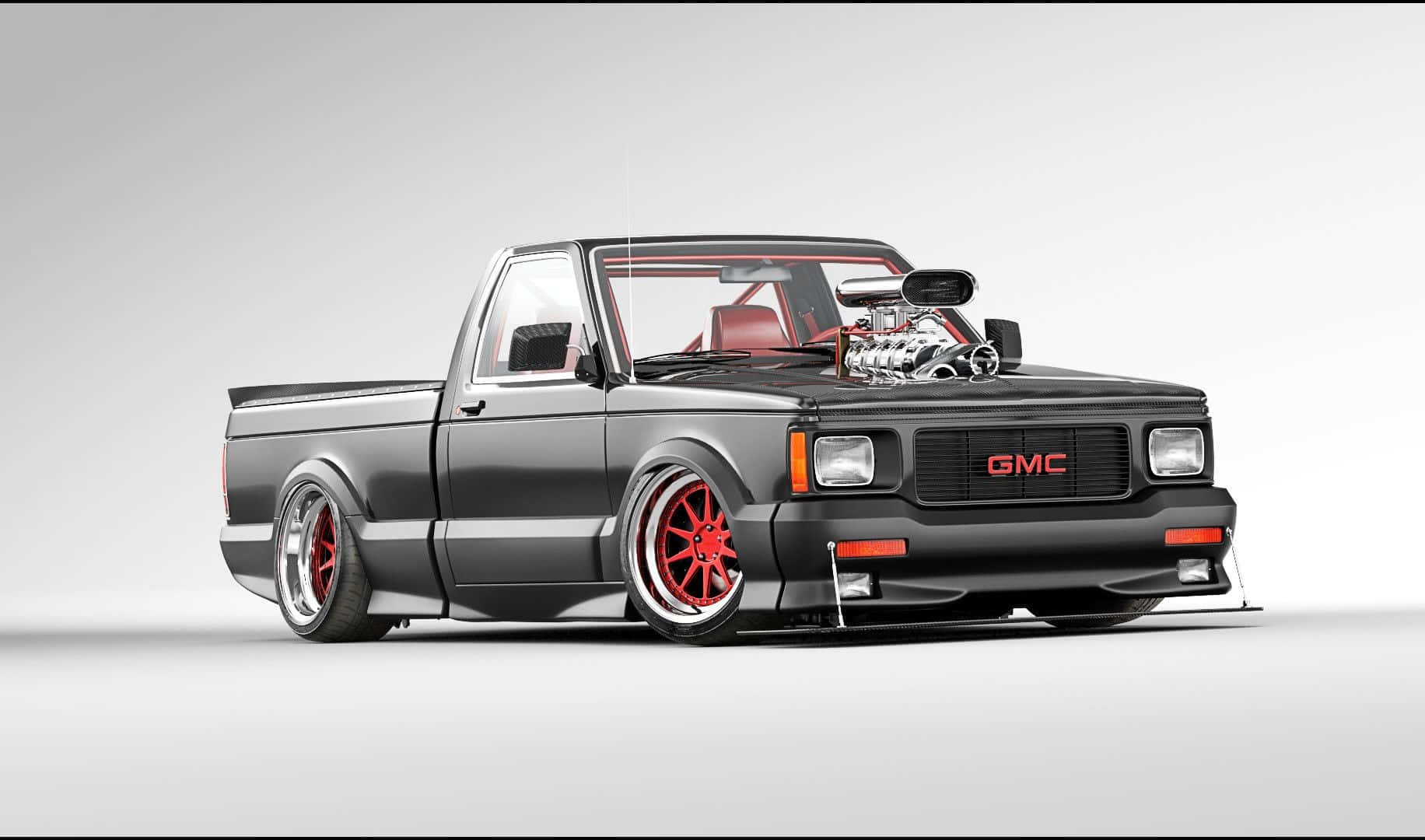 Sleek Gmc Syclone Roaring Through The Countryside Wallpaper