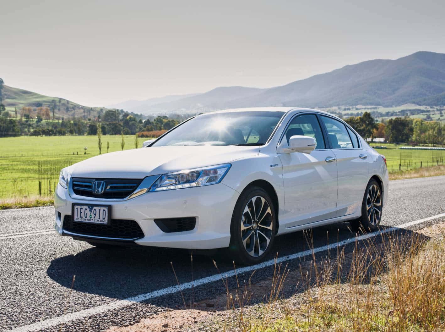 Sleek Honda Accord In Vibrant City Setting Wallpaper