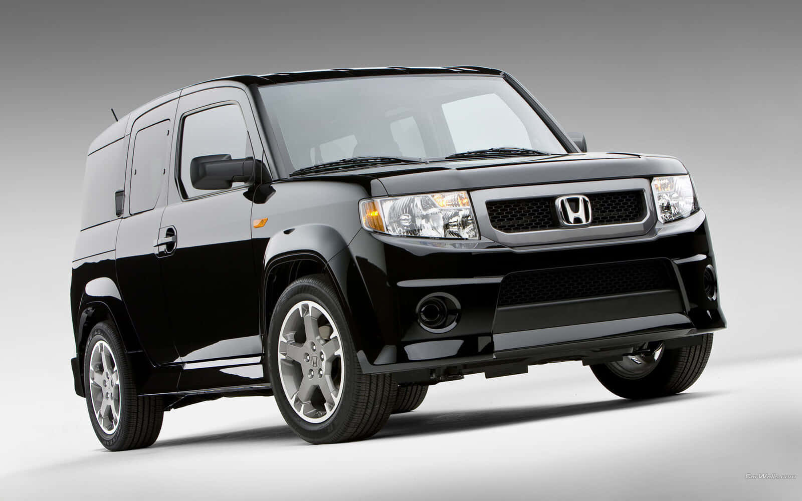 Sleek Honda Element On The Road Wallpaper