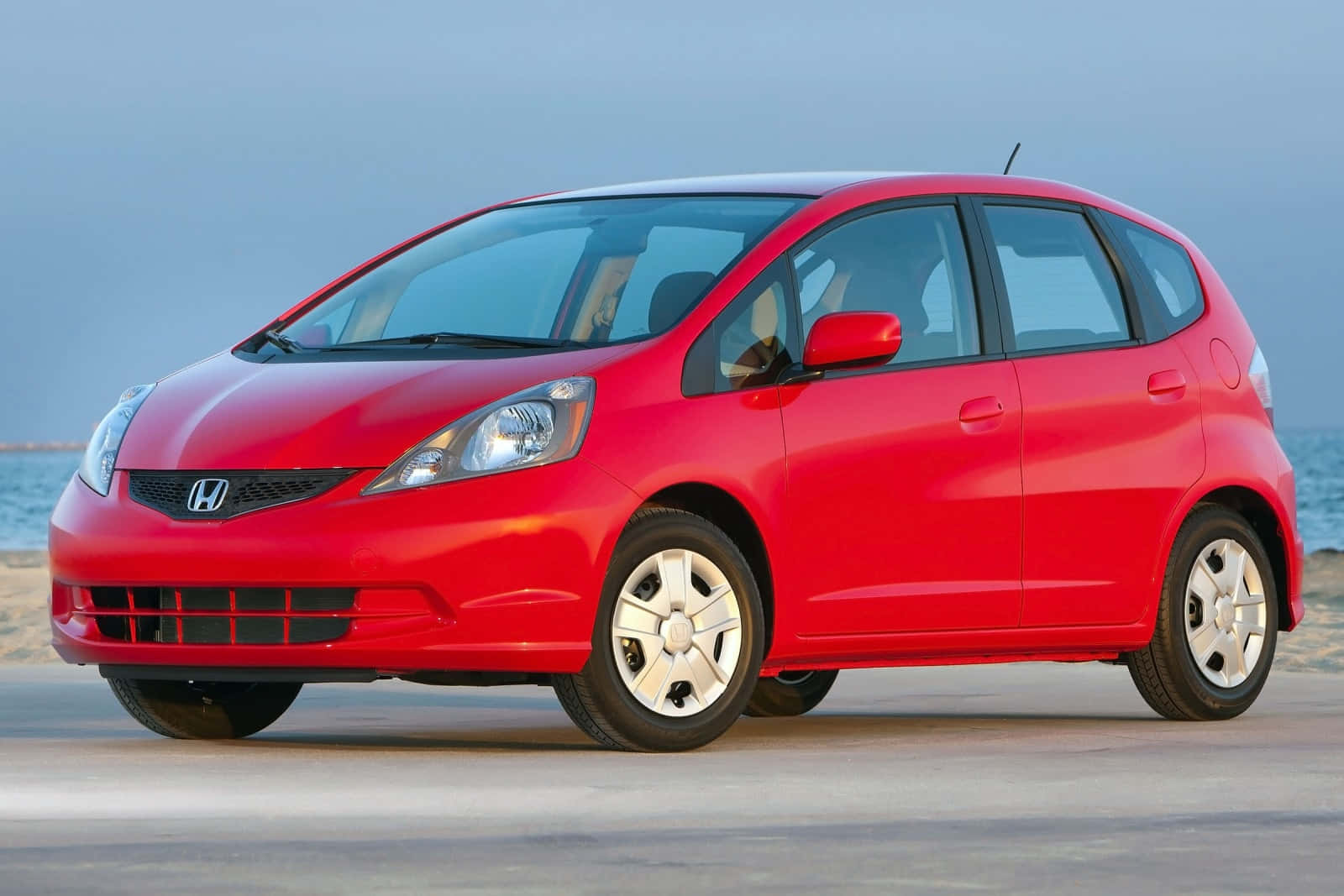 Sleek Honda Fit In Urban Landscape Wallpaper