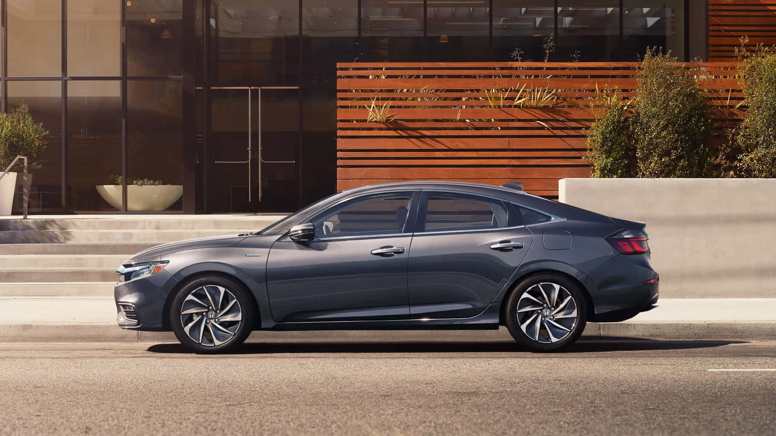 Sleek Honda Insight Hybrid In Motion Wallpaper