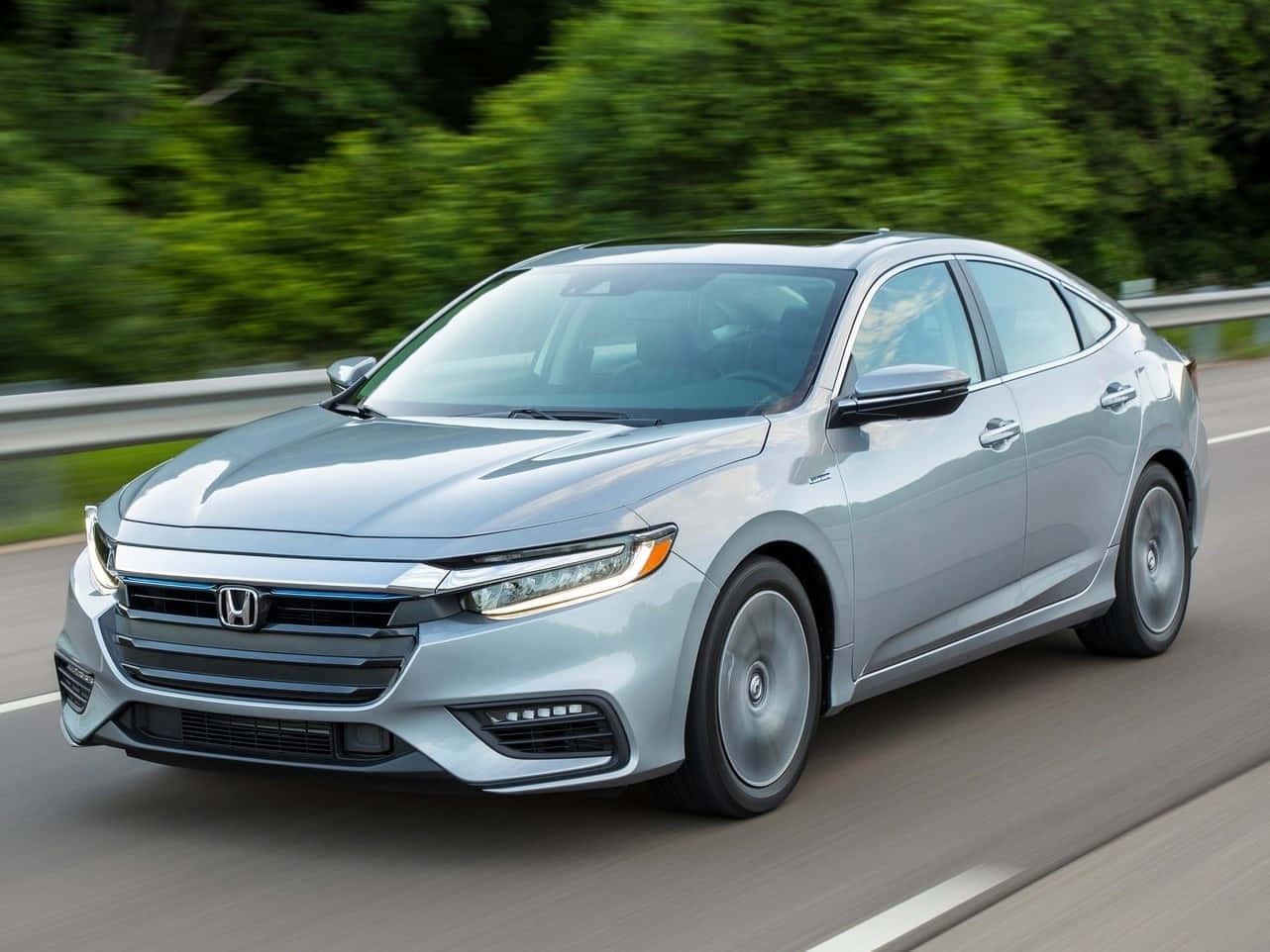 Sleek Honda Insight Hybrid On The Road Wallpaper