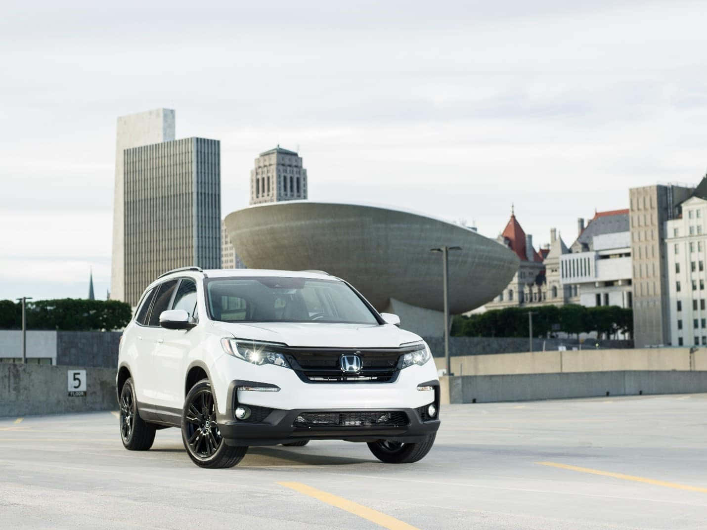 Sleek Honda Pilot Suv In Action Wallpaper