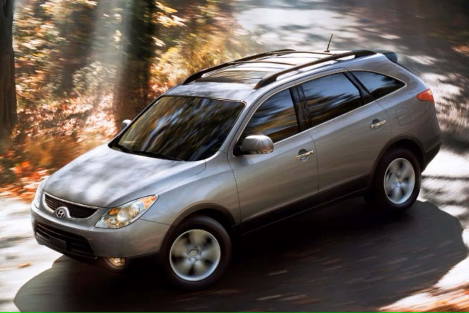 Sleek Hyundai Veracruz Suv Parked By A Scenic Roadway In Nature Wallpaper