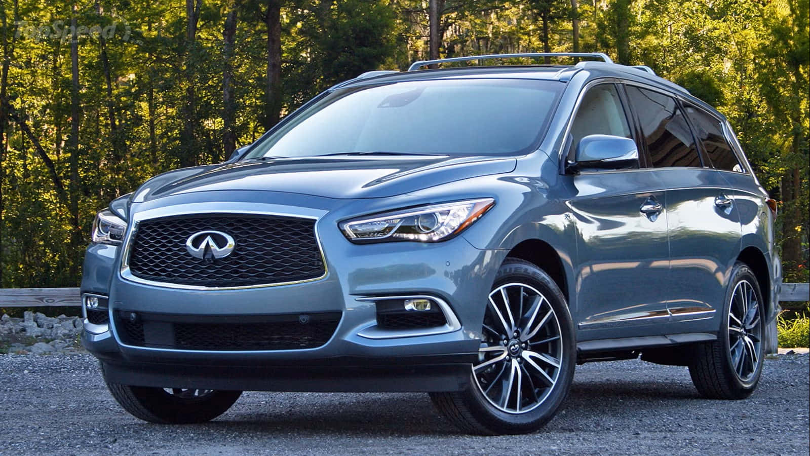 Sleek Infiniti Qx60 In Motion Wallpaper