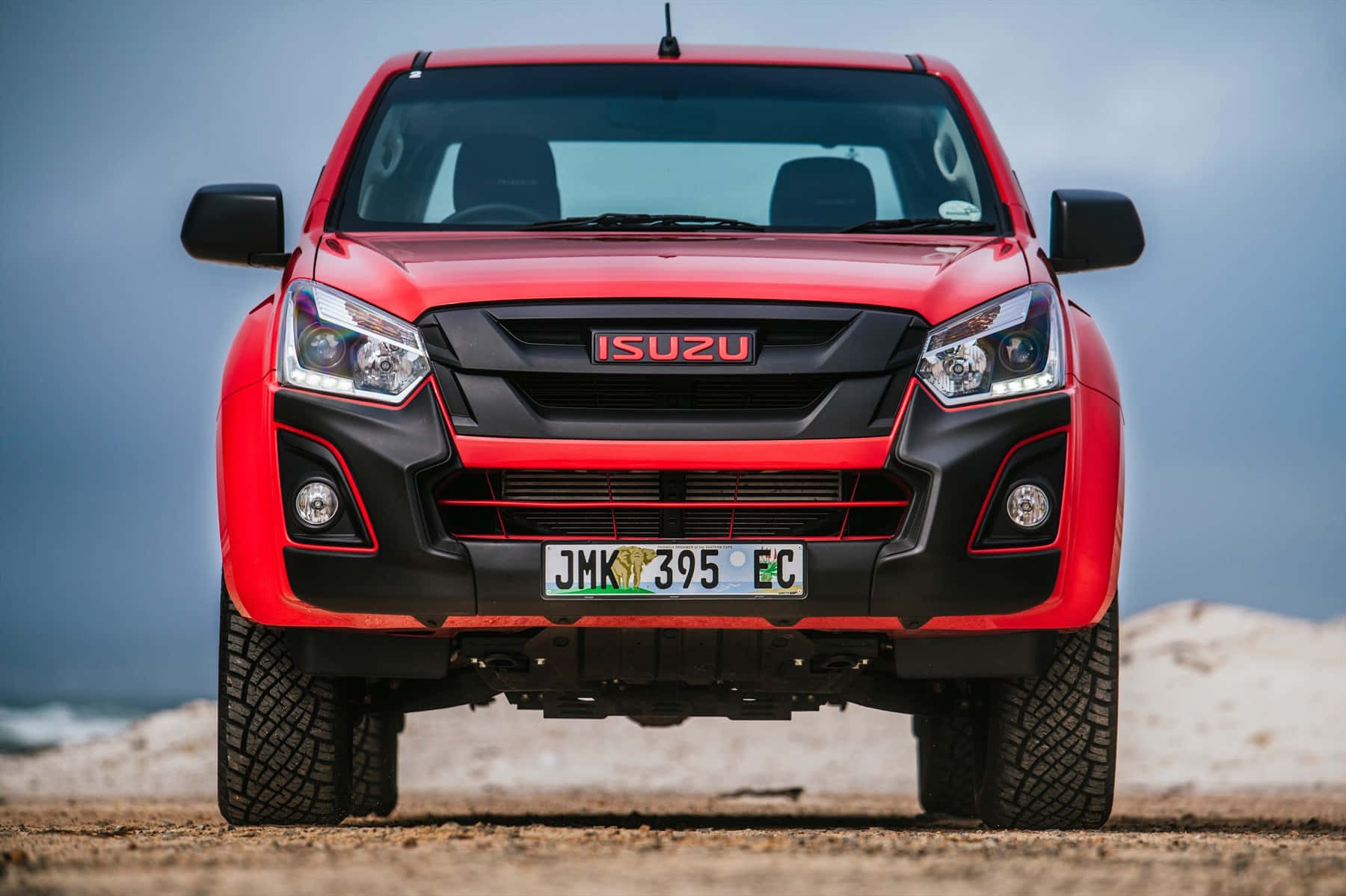 Sleek Isuzu Pickup Truck On The Open Road Wallpaper