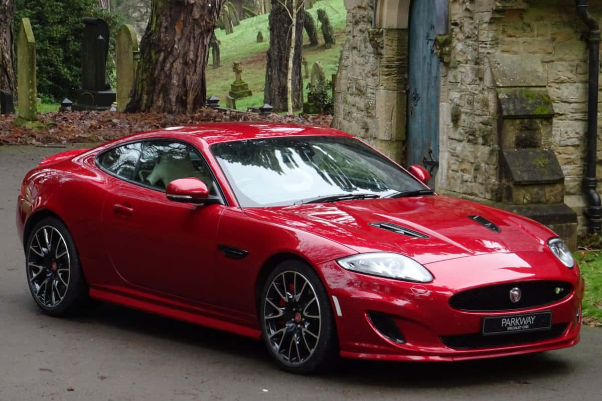 Sleek Jaguar Xkr Sports Coupe In Action Wallpaper