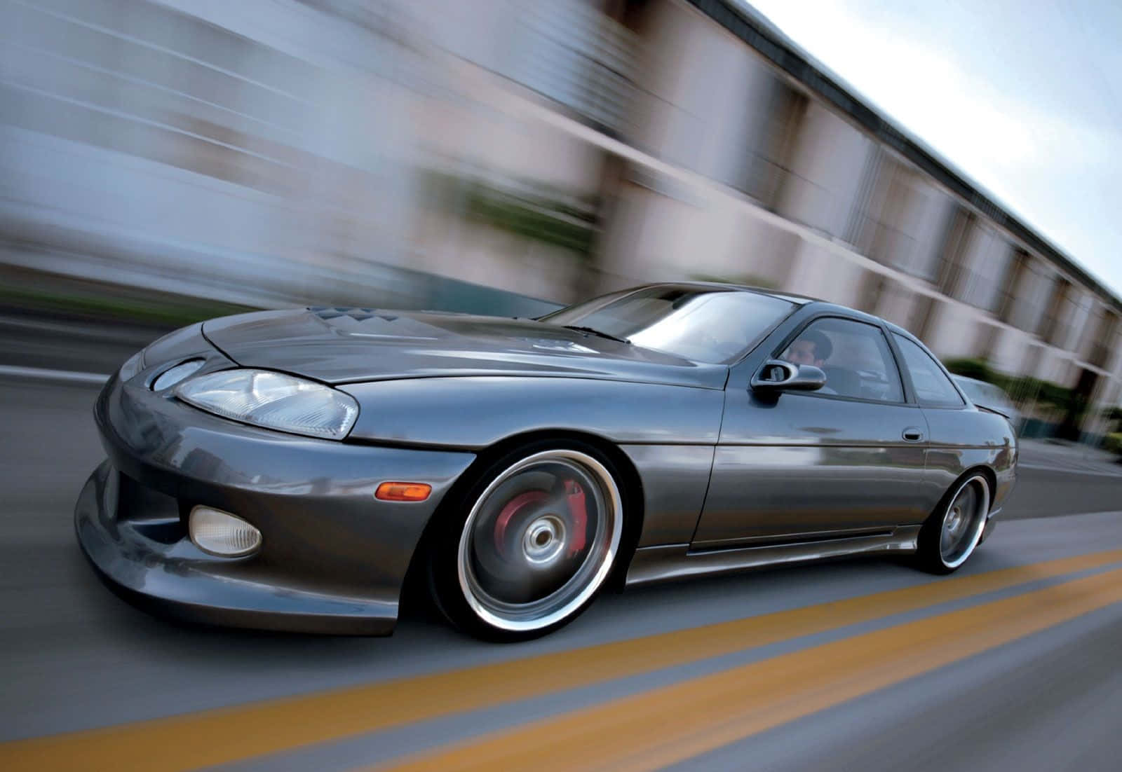 Sleek Lexus Sc 300 In A Beautiful Outdoor Setting Wallpaper