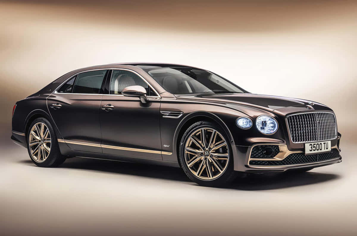 Sleek, Luxurious Bentley Flying Spur In Motion Wallpaper