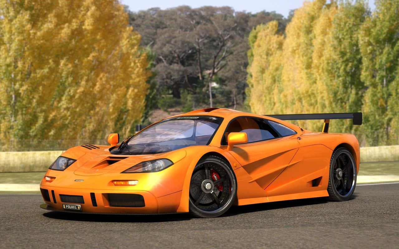 Sleek Mclaren F1 Race Car On The Track Wallpaper