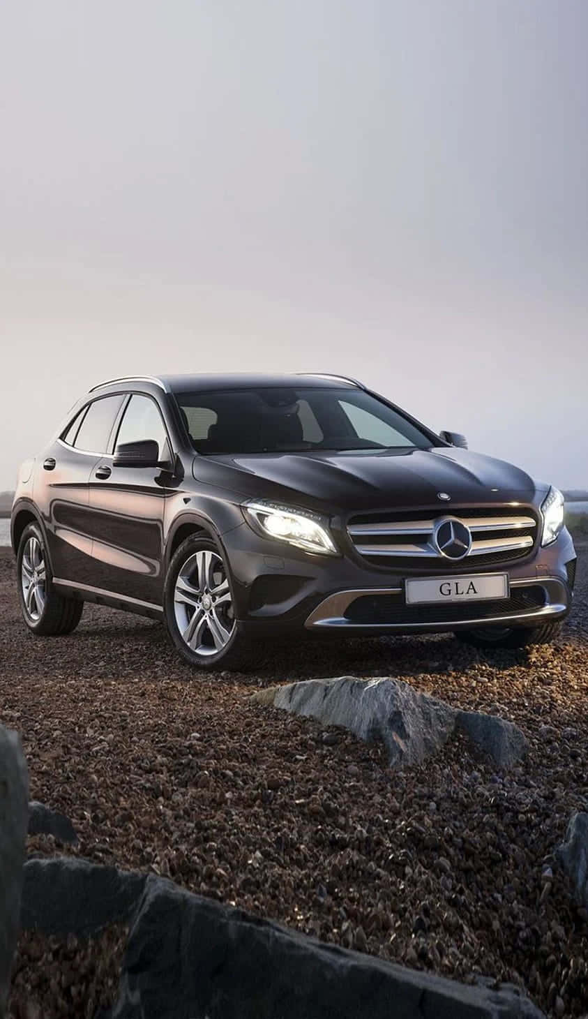 Sleek Mercedes Benz Gla-class In Vivid Nature Setting Wallpaper