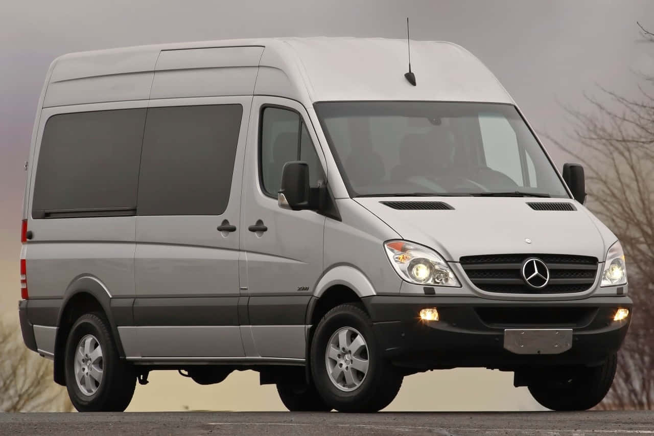 Sleek Mercedes Benz Sprinter On The Road Wallpaper