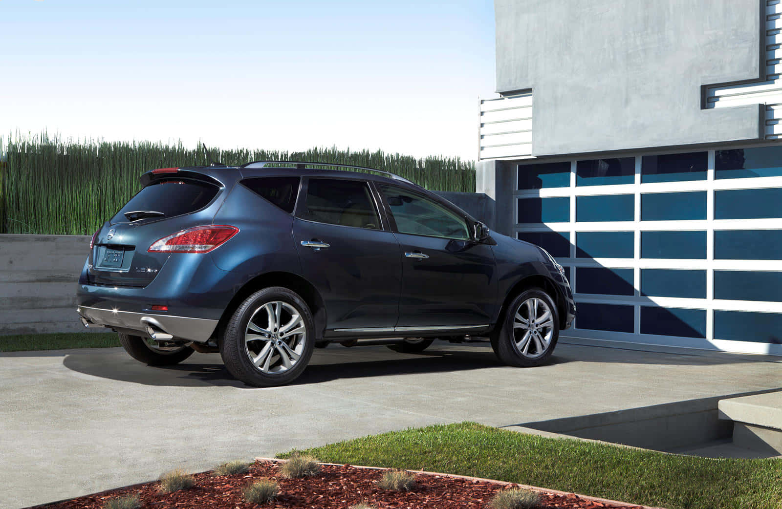 Sleek Nissan Murano Cruising On A Scenic Road Wallpaper