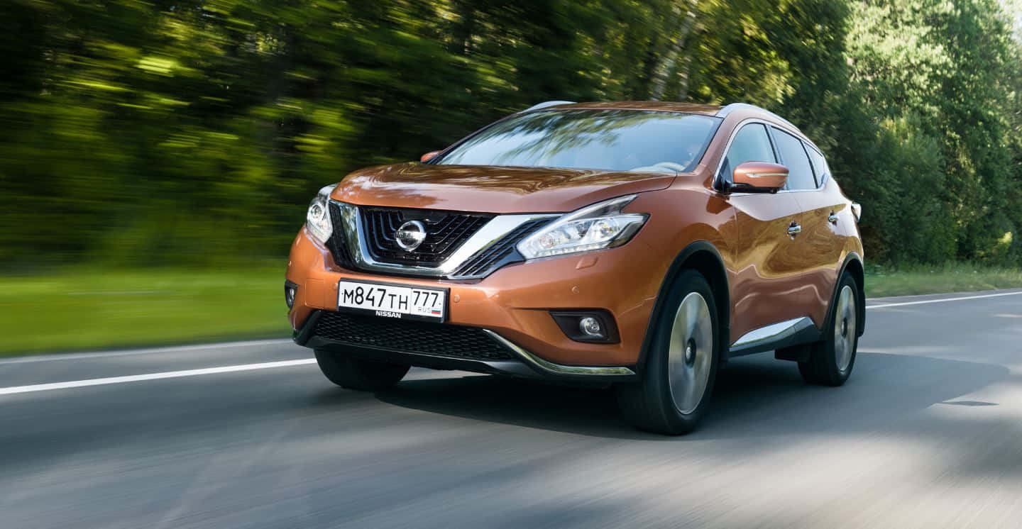 Sleek Nissan Murano Cruising On The Open Road Wallpaper