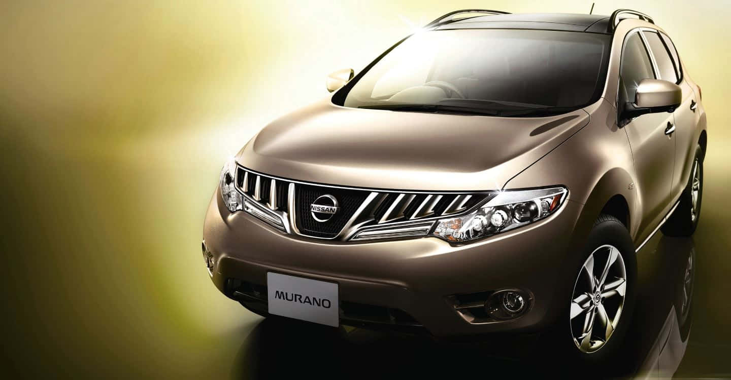 Sleek Nissan Murano Driving On A Scenic Road Wallpaper