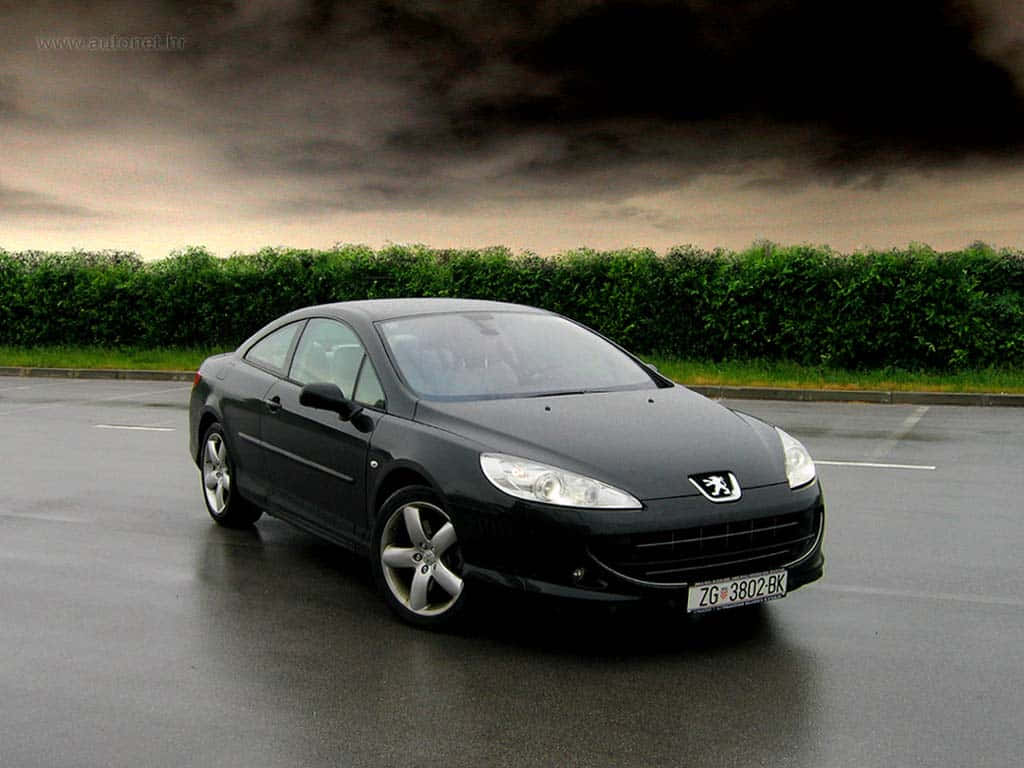 Sleek Peugeot 407 In Urban Landscape Wallpaper