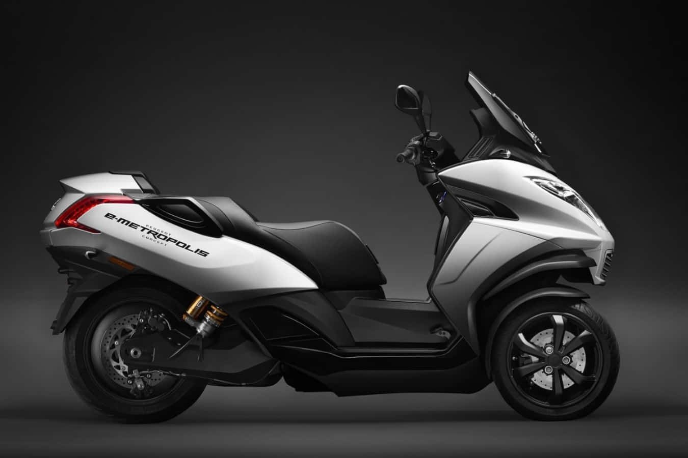 Sleek Peugeot Motorcycle Against Urban Backdrop Wallpaper