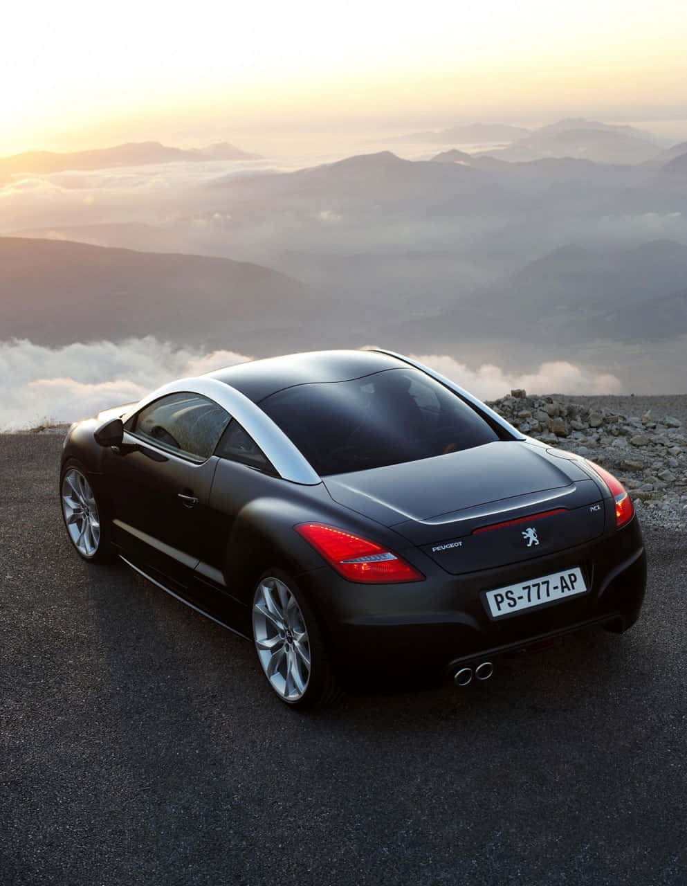 Sleek Peugeot Rcz On The Road Wallpaper