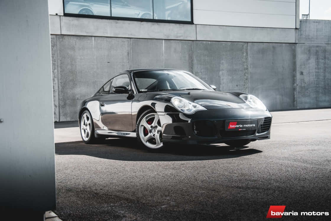 Sleek Porsche 996 Gliding Through The City Wallpaper