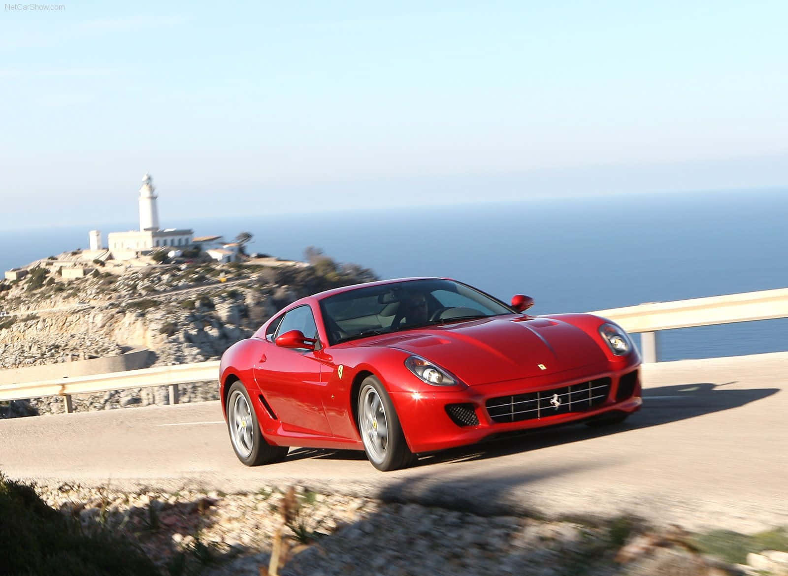 Sleek Red Ferrari 599 Gtb Fiorano In Action Wallpaper