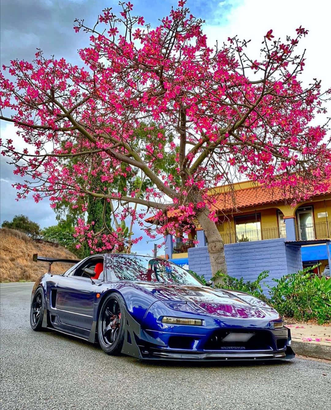 Sleek Red Honda Nsx In Action Wallpaper