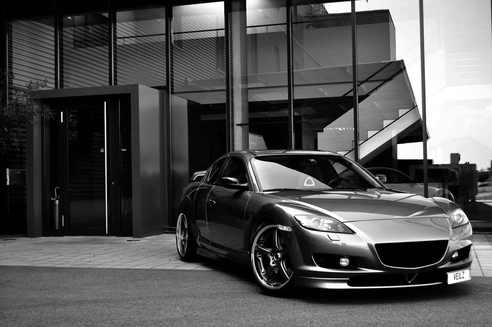 Sleek Red Mazda Rx-8 Sports Car Wallpaper