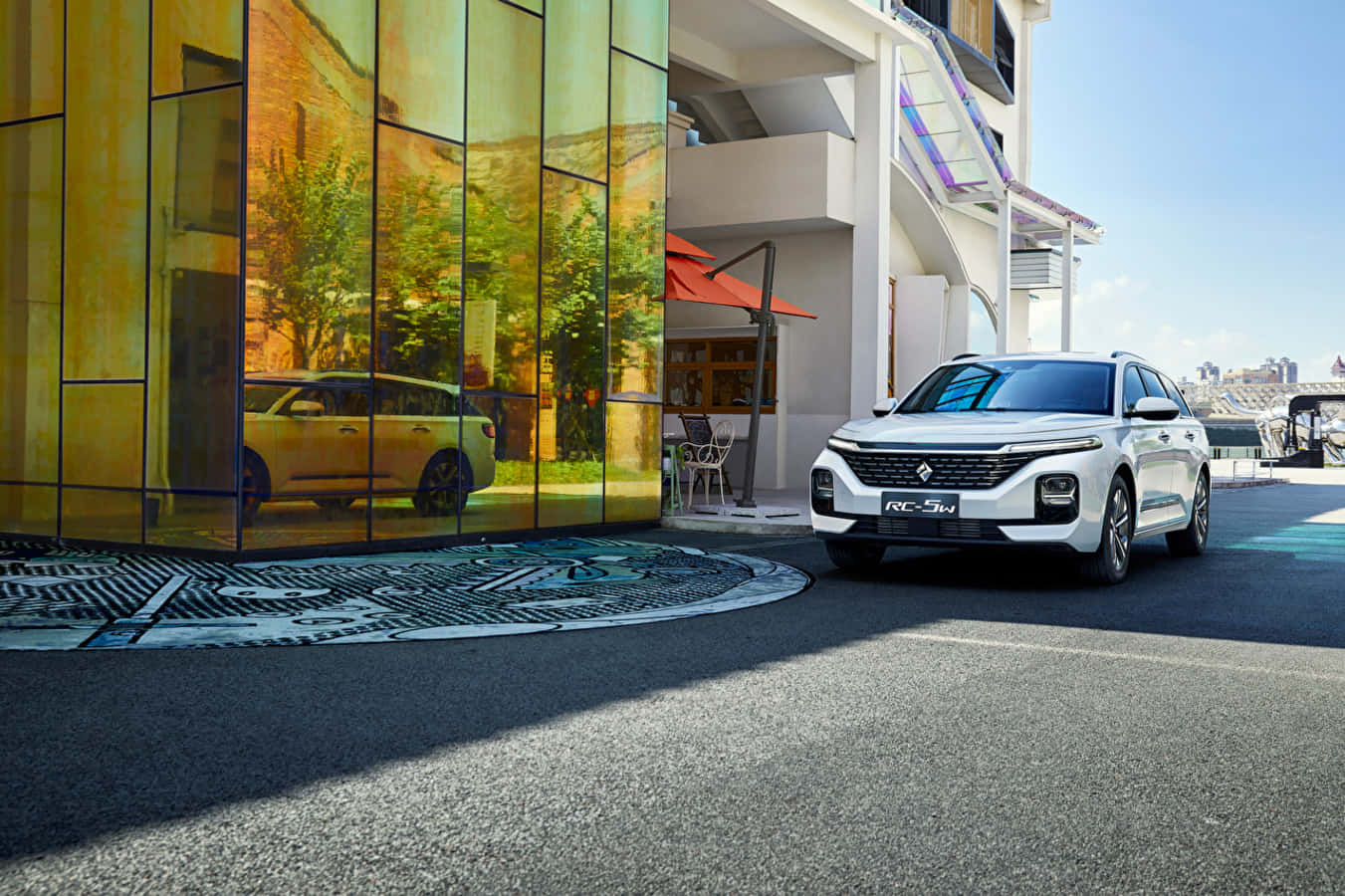 Sleek Silver Baojun Car Parked Under A Blue Sky Wallpaper