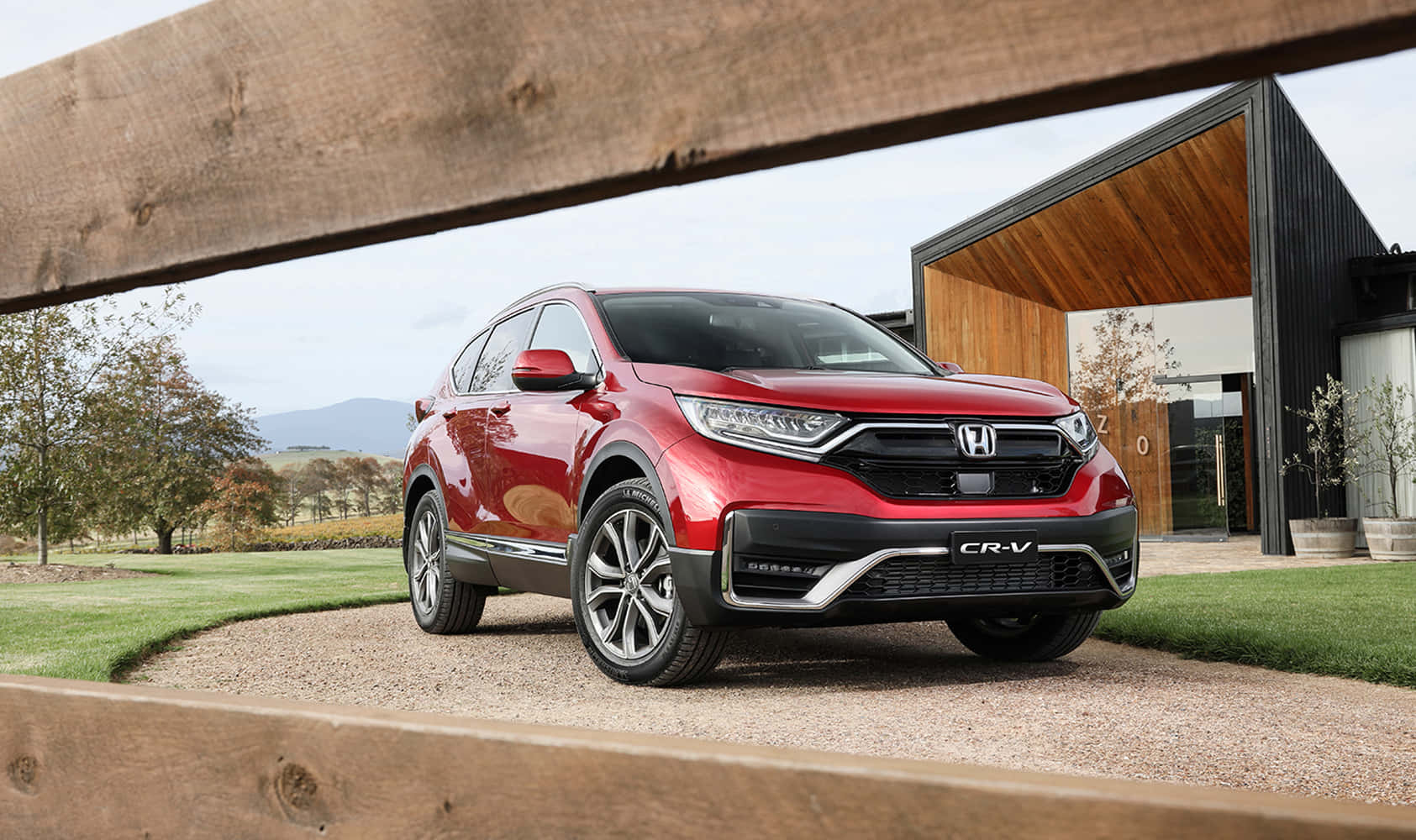 Sleek Silver Honda Cr-v On Scenic Road Wallpaper