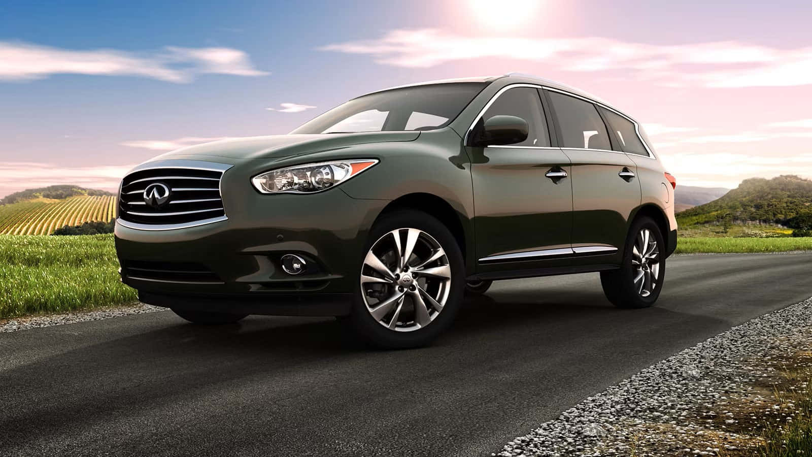 Sleek Silver Infiniti Qx60 On The Road Wallpaper