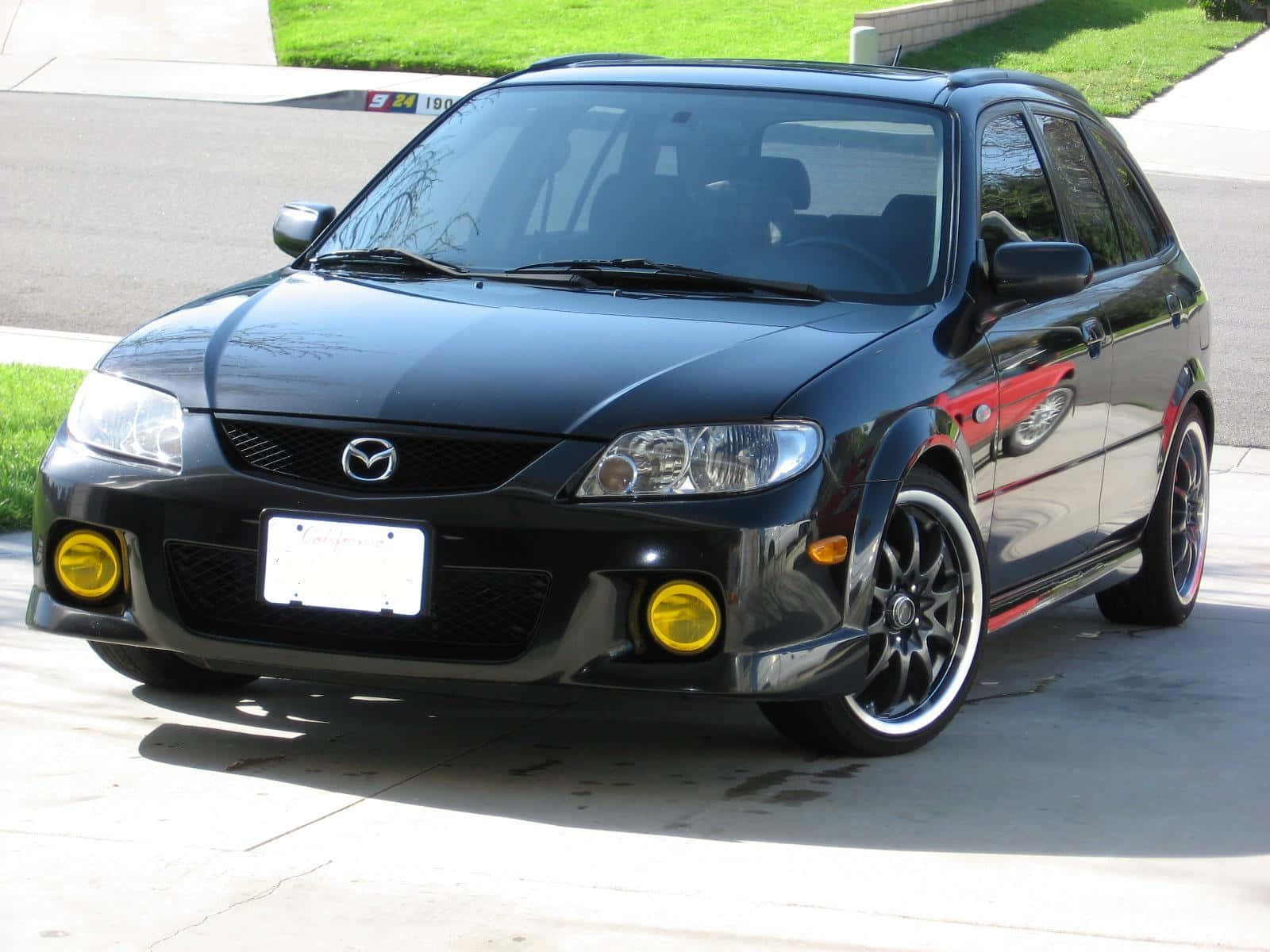 Sleek Silver Mazda Protege In High-definition Wallpaper